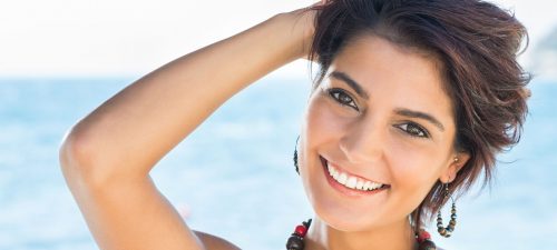 Happy Woman Smiling on Beach Beautiful Healthy Teeth