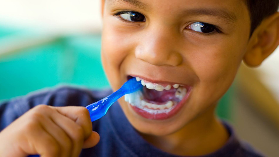 Young Boy Brushing His Teeth