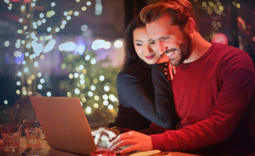Smiling Man and Woman Planning 2019 New Years Dental Health Resolutions